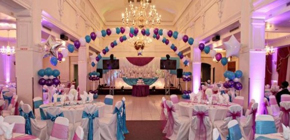 Quinceanera ballroom, a banquet hall decorated with purple and blue decorations