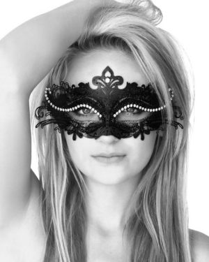 A woman wearing a mask, with a black mask on her face, for a Quinceanera celebration.
