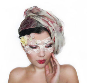 Quinceanera headpiece, a woman with a veil and a flower in her hair