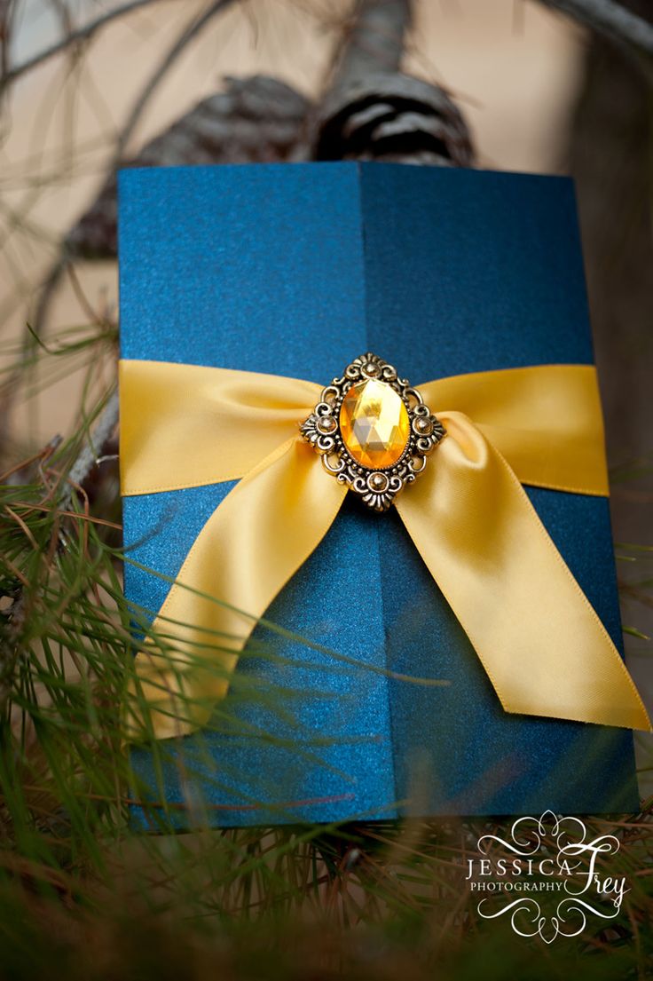 Quinceanera Invitation, a blue box with a yellow ribbon and a brooch, Bella y Bestia themed