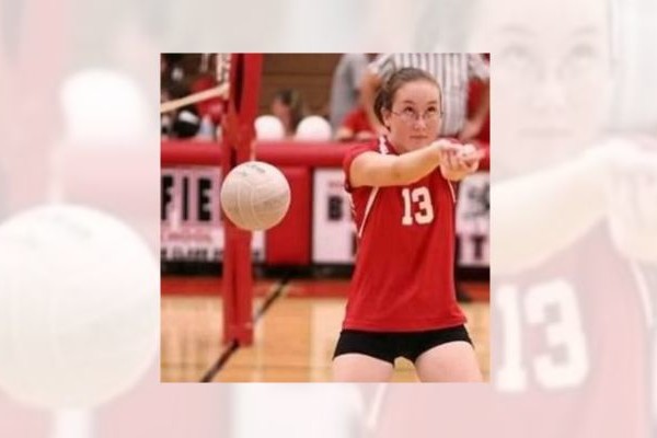Girl playing volleyball misses the ball