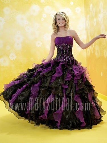 A woman in a purple and black dress at the ox restaurant & lounge, Quinceanera