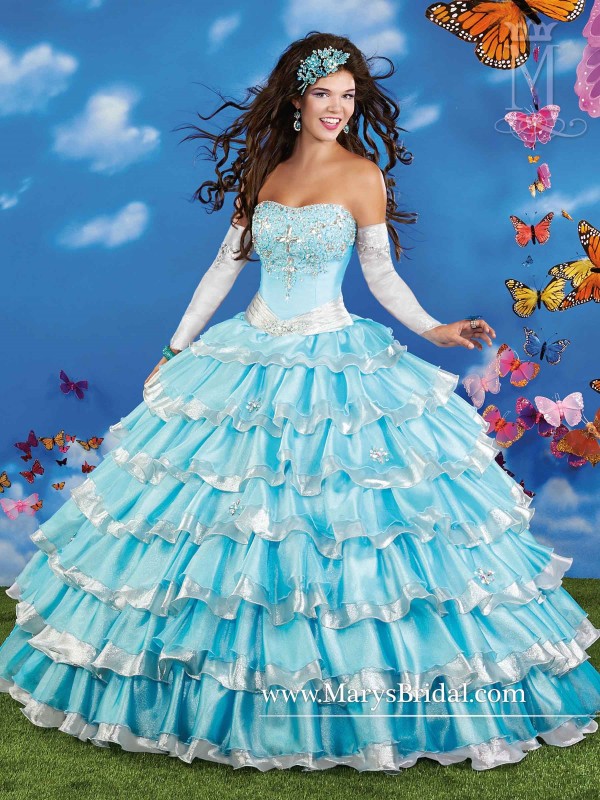 Quinceanera: A woman wearing a blue and white gown