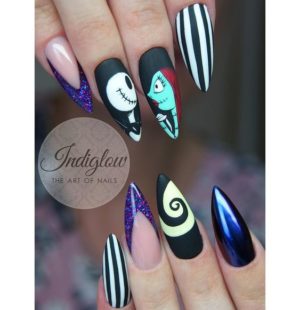 An elegant Quinceanera-themed acrylic nail design with a black and white manicure featuring a decorative pattern