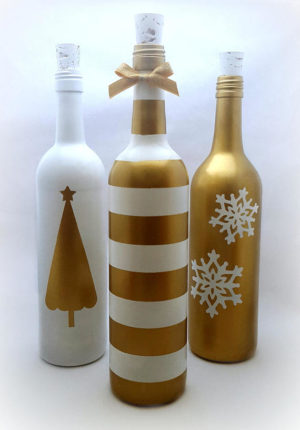 Glass bottle, three wine bottles decorated with gold and white designs for Quinceanera