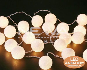 Quinceanera image: light Cotton Ball Lights, a blacklight party with neon decorations and balloons