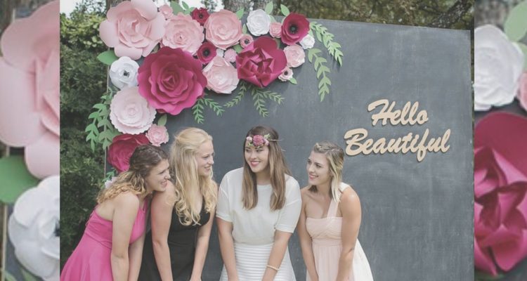 girls in front of flower backdrop