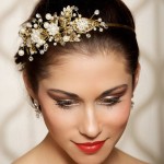 Quinceanera girl wearing a Tiara, a white dress, and a flower in her hair