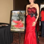 Quinceanera gown, a woman in a red dress standing next to a painting