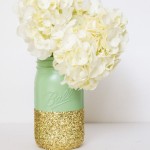 A beautiful floral arrangement of white flowers in a vase on a table, perfect for a Quinceanera celebration.