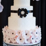 Quinceanera cake, a white Quinceanera cake with black and white flowers