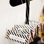 A Quinceanera party with a bunch of bags hanging from a string.