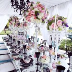A Quinceanera celebration with a long table adorned with beautiful flowers