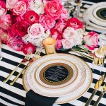 Floral design for a Quinceanera with a black and white table setting and pink flowers