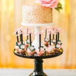 Quinceanera cake, a three tiered cake adorned with pink flowers on top