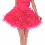 Quinceanera day dress. A woman in a pink dress posing for a picture.