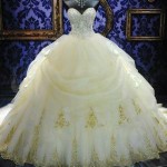 Quinceanera ball gown wedding dress with bling, displayed on a mannequin.