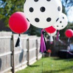 Quinceanera Balloon, a bunch of balloons that are in the grass