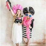 Two women dressed in Quinceanera costumes posing for a picture