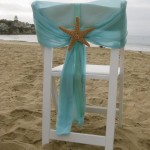 Quinceanera, a chair with a starfish on top of it. Decoracion bautizo en la playa, a chair with a starfish on top of it.