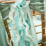 A close up of a Quinceanera dress with a ribbon on it