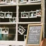 A Quinceanera-themed window guestbook with a collection of pictures hanging on it
