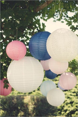 Paper lanterns hanging from a tree, decorate Quinceanera