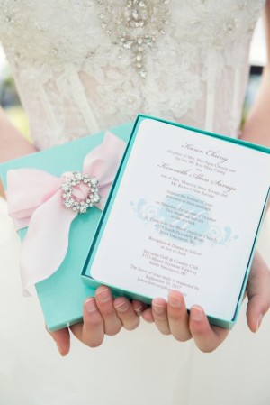Quinceanera Invitation, a woman in a Quinceanera dress holding a blue box with a pink bow