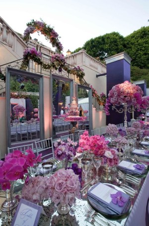 Floral design with a lot of flowers on a long table for a Quinceanera