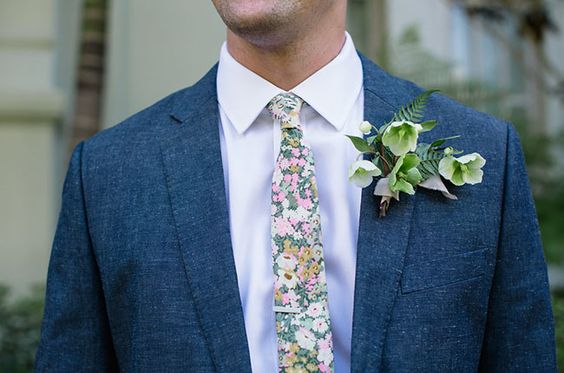 Quinceanera, a man in a suit and tie with a flower on his lapel