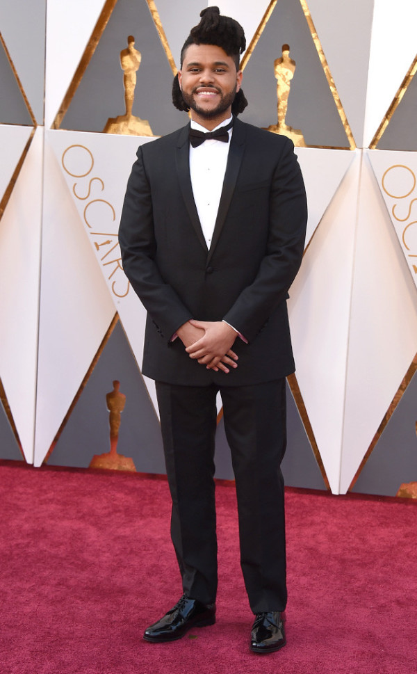 The Weeknd, a man in a tuxedo standing on a red carpet at a Quinceanera event.