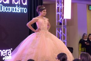 Quinceanera gown, a woman in a wedding dress on a runway