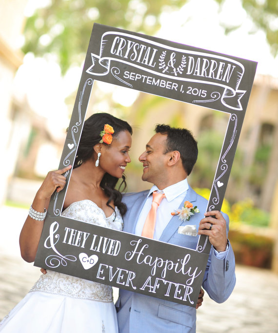 Quinceanera photograph, a bride and groom pose for a picture with a chalkboard sign