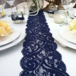 A Quinceanera-themed table set with a blue table runner