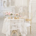A white table topped with a white tablecloth