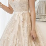 A woman in a wedding dress standing in front of a mirror for a Quinceanera gown