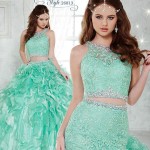 A woman wearing a green two-piece Quinceañera dress that can be tied.