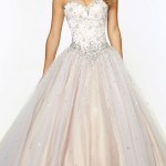A woman in a Quinceanera ball gown posing for a picture