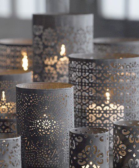 Close up of a group of lit candles on a Quinceanera wedding invitation