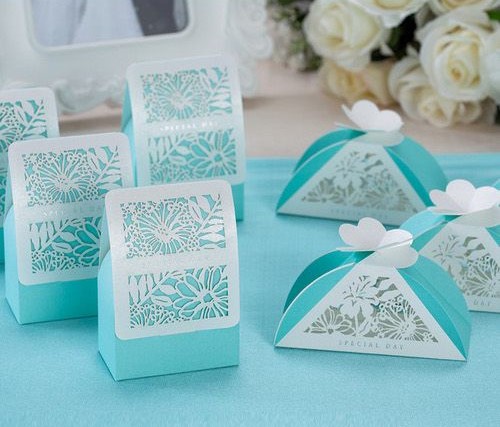 Quinceanera favors Wedding Invitation, a table topped with blue and white boxes