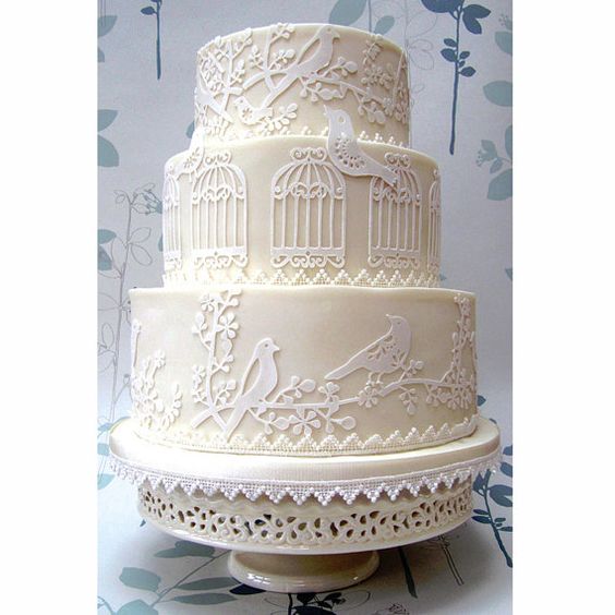 A Quinceanera cake Cupcake, a three tiered Quinceanera cake with a birdcage on top
