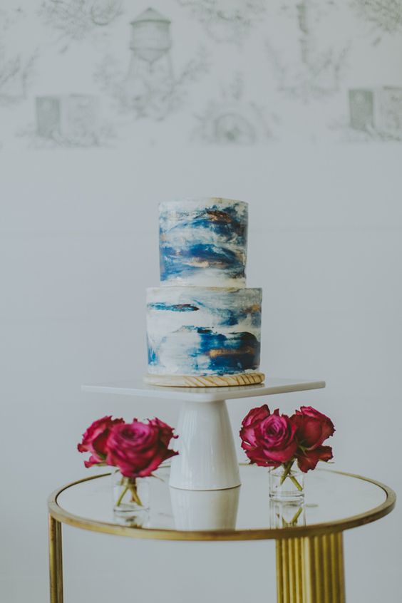 Quinceanera cake, a three tiered cake on a gold table