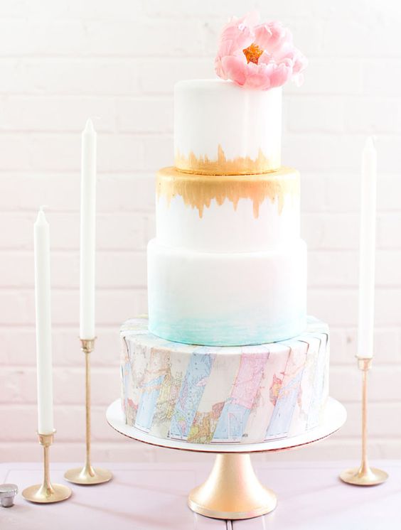 A Quinceanera cake, a three-tiered cake with a pink flower on top, decorated with sugar.
