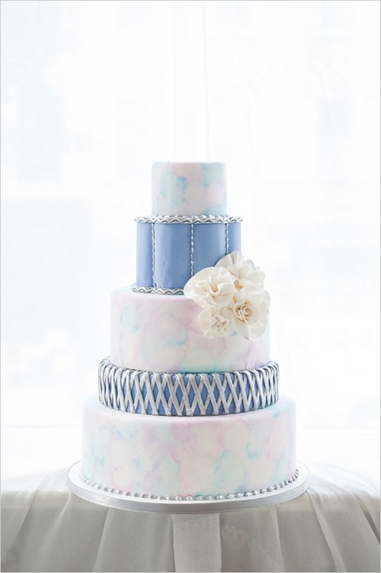 Quinceanera cake, a three tiered cake with a flower on top