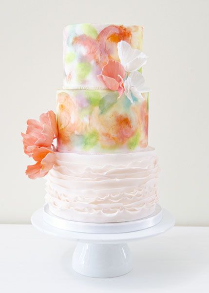 Quinceanera cake, a three tiered cake with flowers on top