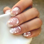 A Quinceanera themed image featuring a woman holding a cup of coffee with white flowers on it, and showcasing a manicure with outline flower nails.