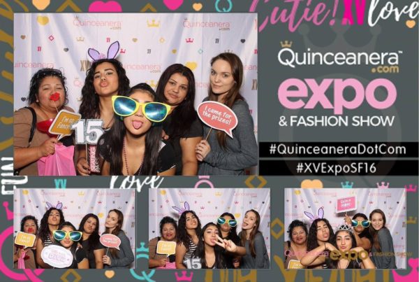 A group of women posing for a photo booth at a friendship Quinceañera