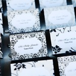 A close-up of a bunch of Quinceanera place cards on a table