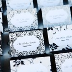 A close-up of a bunch of Quinceanera place cards on a table