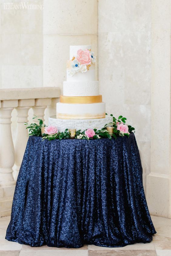 Quinceanera cake sitting on top of a table